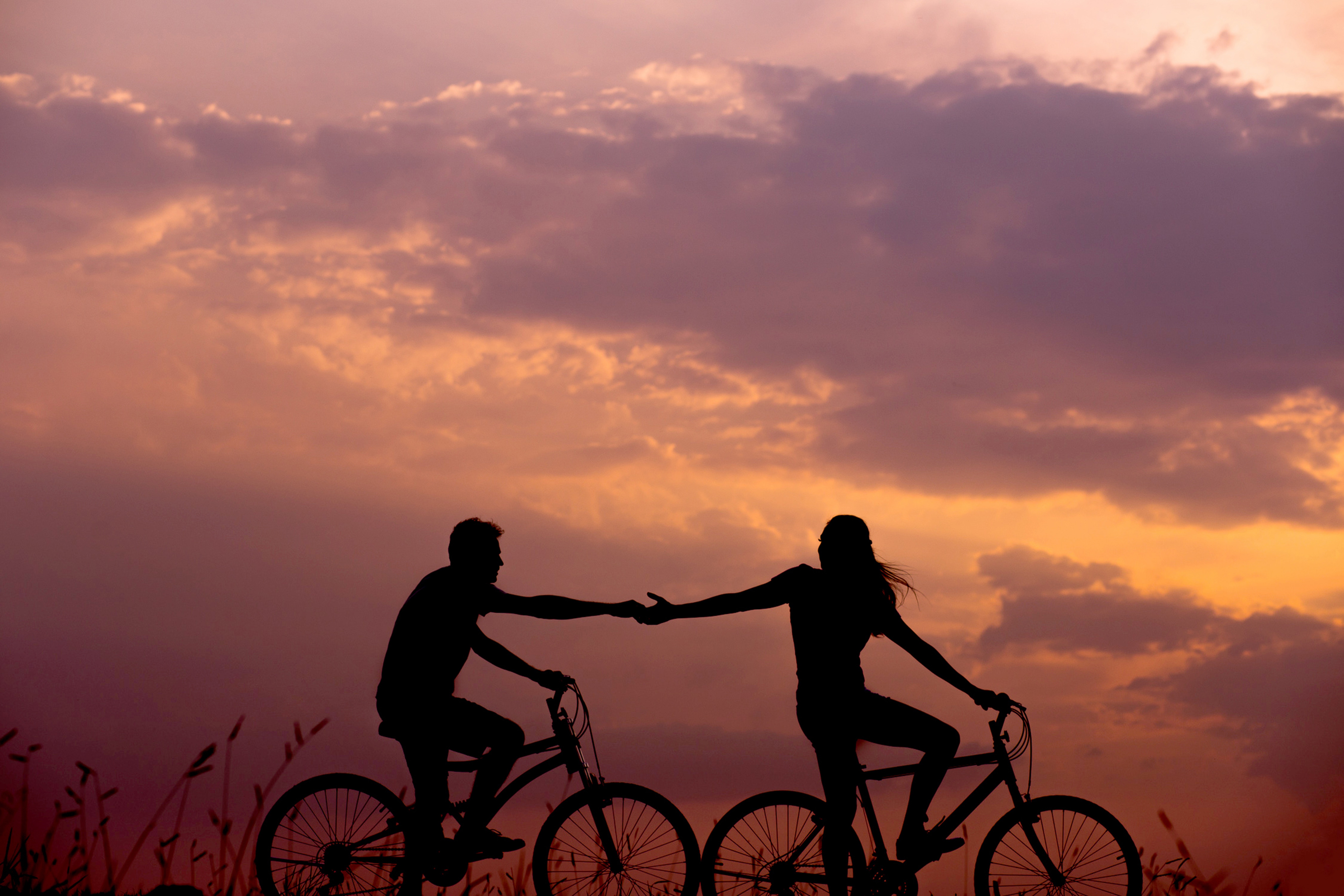 couple riding bikes love